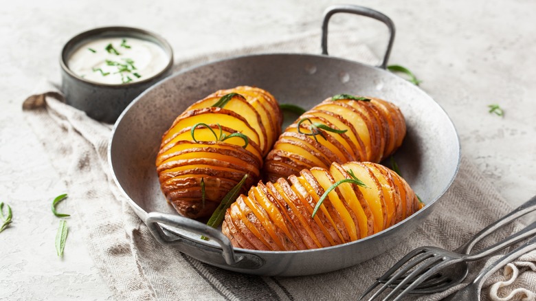 Baked hasselback potatoes in dish