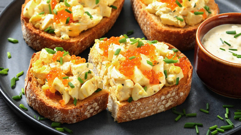 Egg salad toast topped with caviar.