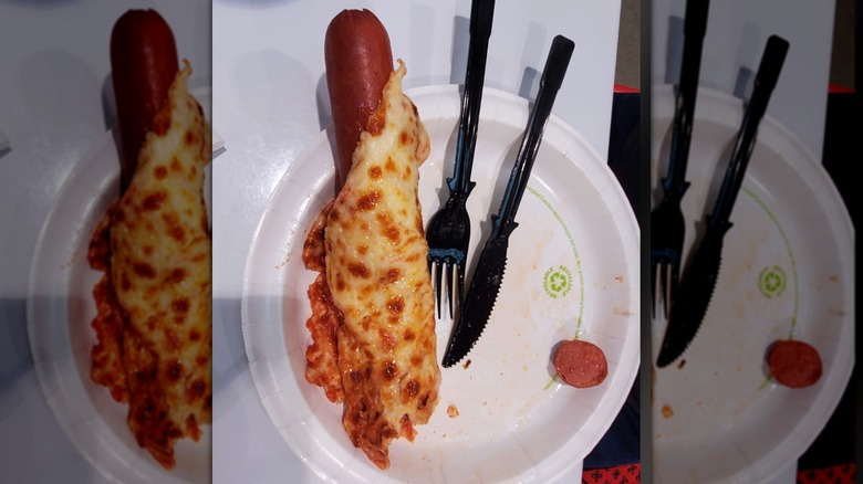 Hot dog wrapped in cheese.