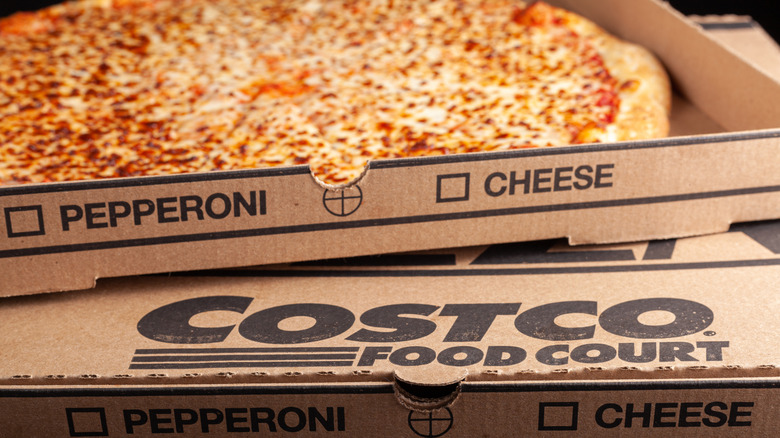 Two stacked Costco pizza boxes.