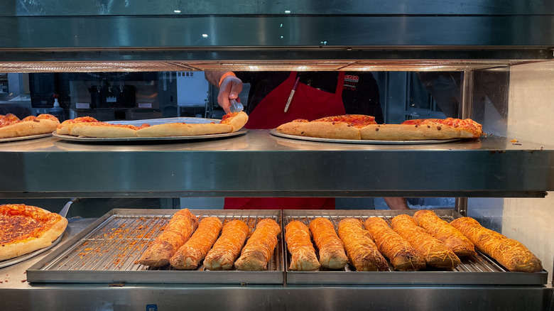 Costco chicken bakes and pizzas pictured.
