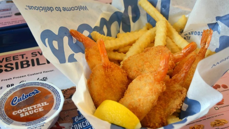 A basket of Culver's butterflied jumbo shrimp with fries and cocktail sauce