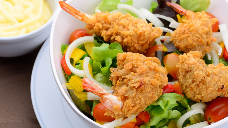 Fried shrimp on a side salad