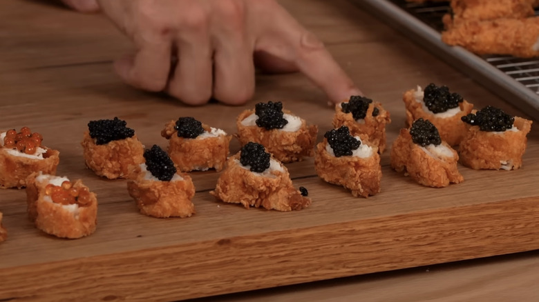 Fried chicken bites topped with various caviar