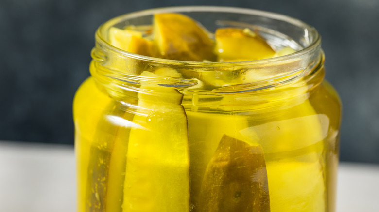 open jar of pickle spears