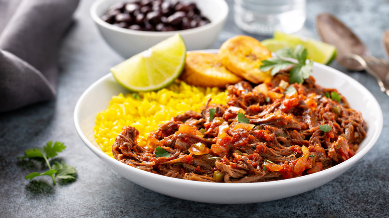 Cuban-style ropa vieja with sides.
