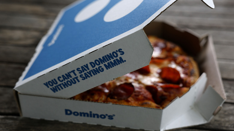 A Domino's pizza inside its signature box