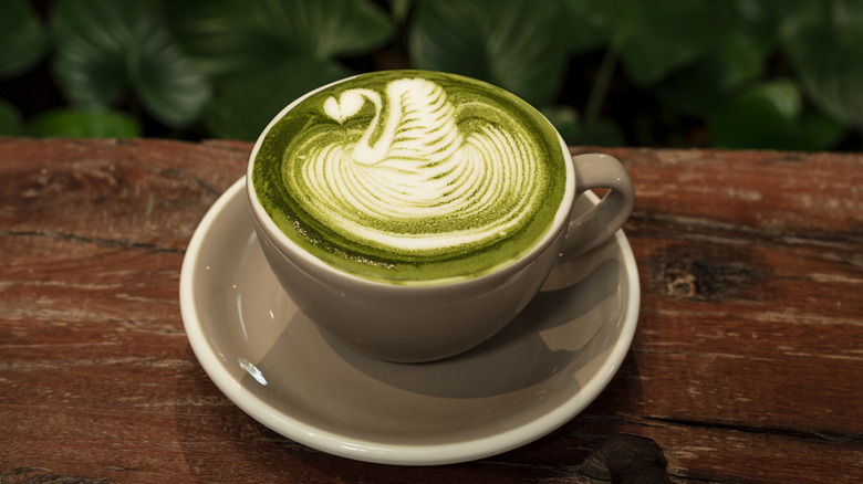 Matcha latte in a cup with foam art