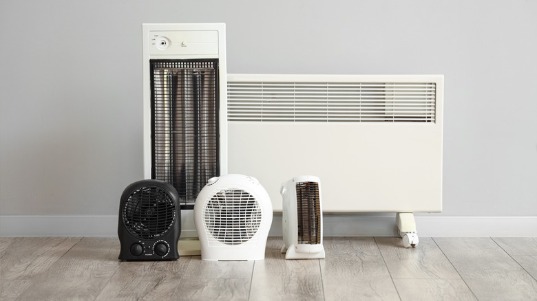 Different heaters displayed against a wall.