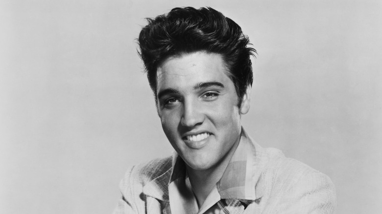 Black and white photo of Elvis Presley smiling