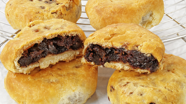 eccles cakes cut open on wire rack