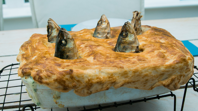 Stargazy pie with sardine heads 