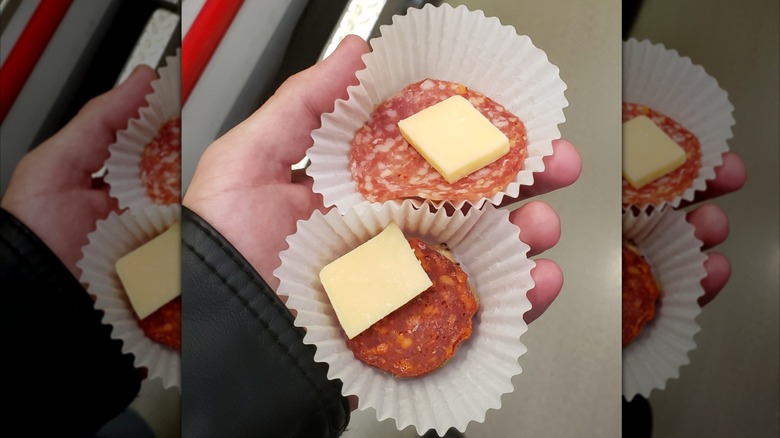 A photo of someone holding free samples at a Costco