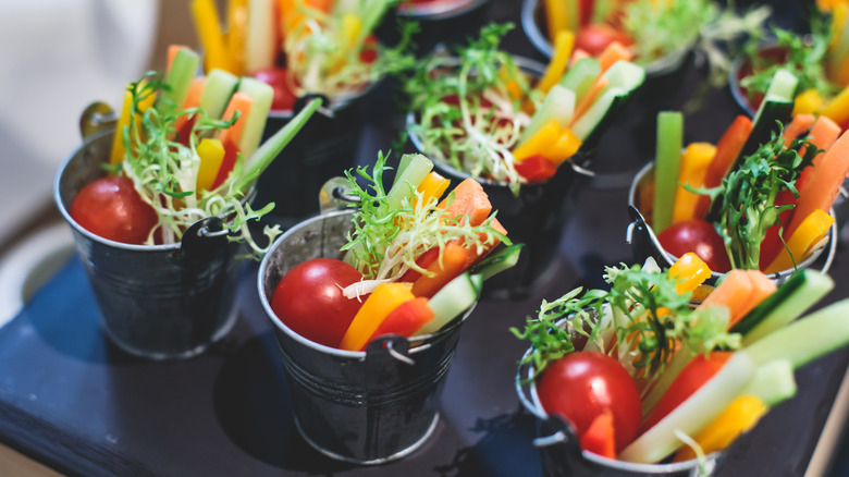 chopped vegetables in small pots
