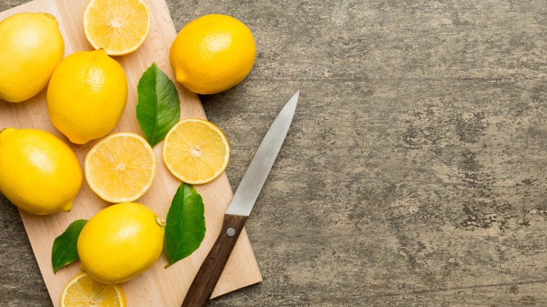 Sliced lemons on cutting board