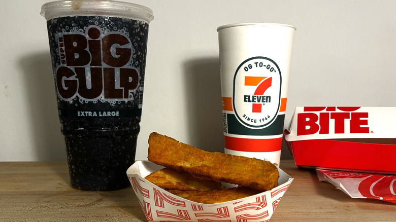 Tray of 7-Eleven potato wedges and Big Gulp