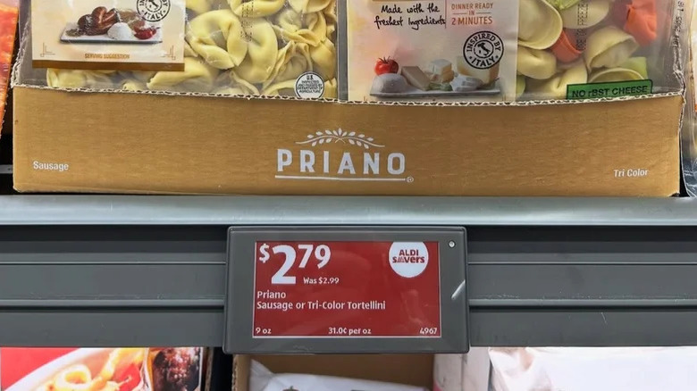 Aldi's price drop logo next to (Extra) low prices in a red background.