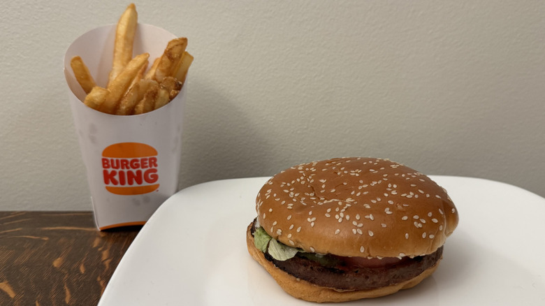 Impossible Whopper on plate next to Burger King fries