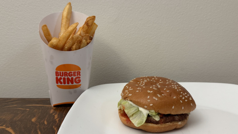 Whopper Jr. on plate next to Burger King fries