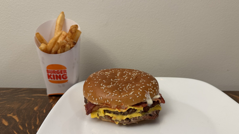 Bacon King on plate next to Burger King soft drink