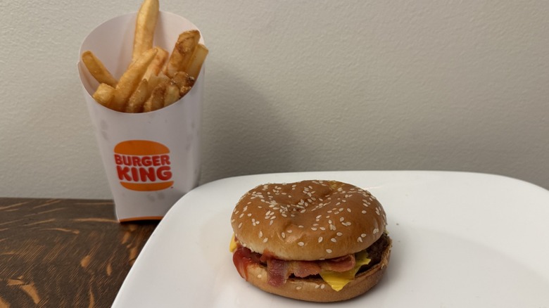 Bacon Cheeseburger on plate next to Burger King fries