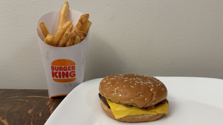 BBQ Bacon Whopper Jr. on plate next to Burger King fries