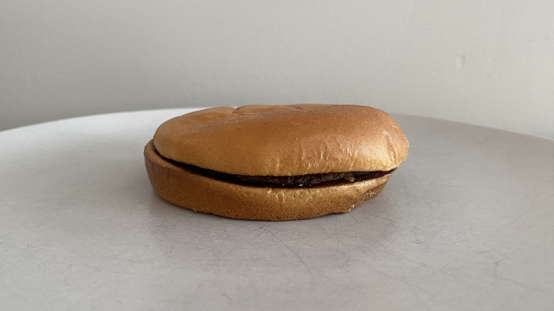 McDonald's Hamburger sitting on a plate