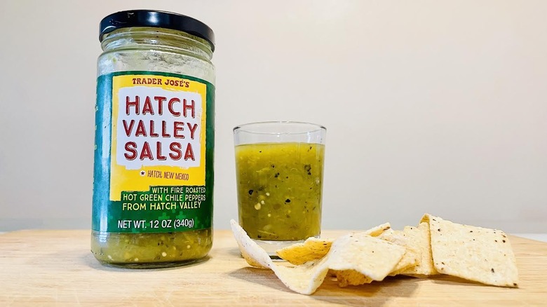 Jar and dish of Trader Joe's Hatch Valley Salsa with tortilla chips