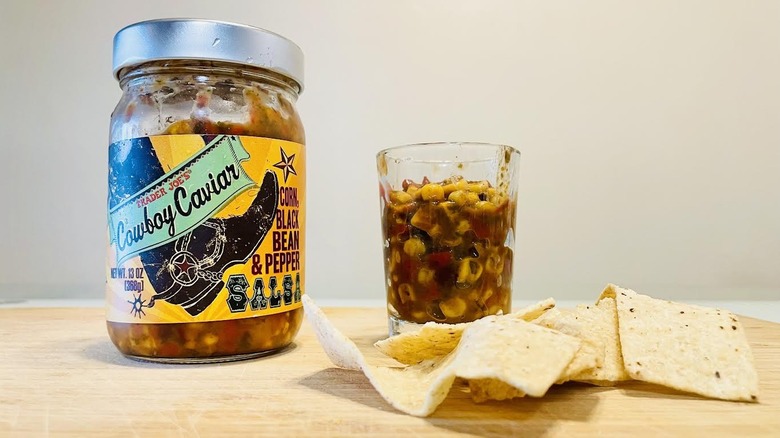 Jar and dish of Trader Joe's Cowboy Caviar Salsa with tortilla chips