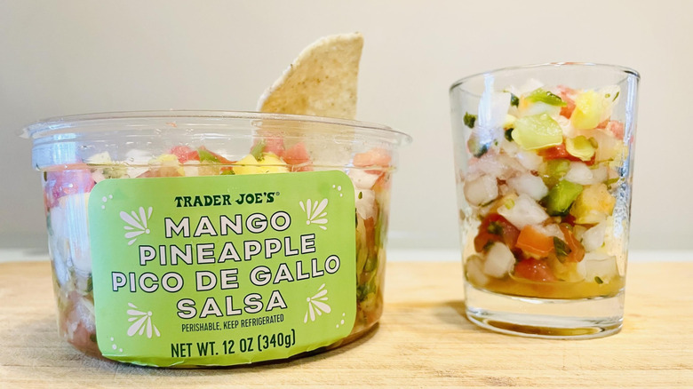 Container and dish of Trader Joe's Mango Pineapple Pico De Gallo Salsa