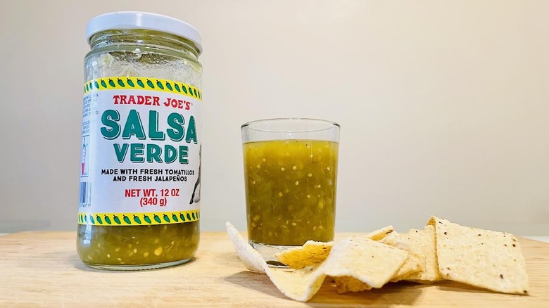 Jar and dish of Trader Joe's Salsa Verde with tortilla chips