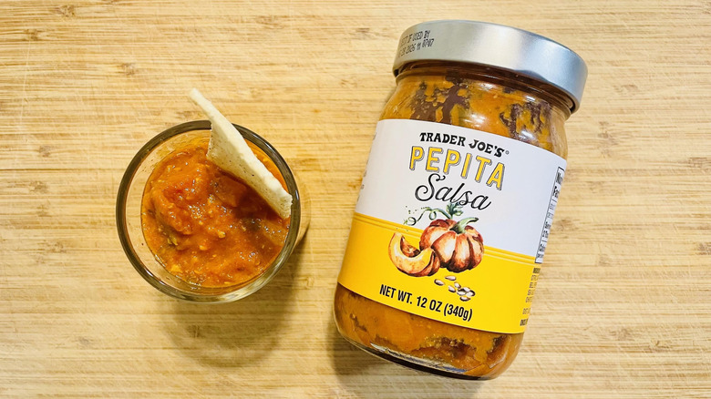 Overhead view of Trader Joe's Pepita Salsa with dish on side