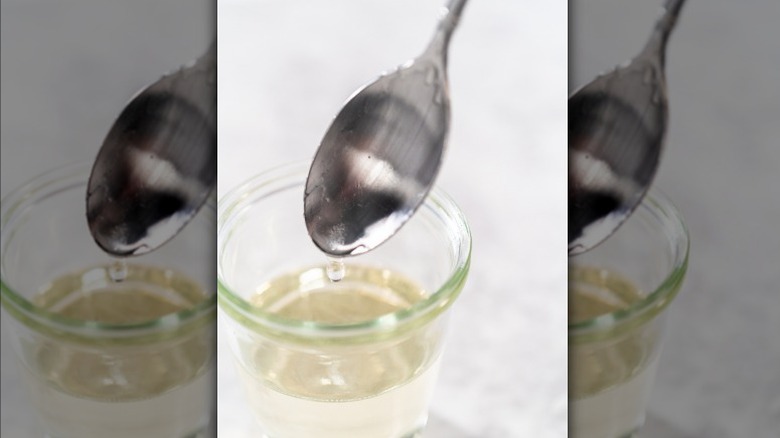 Simple syrup is small glass jar with spoon