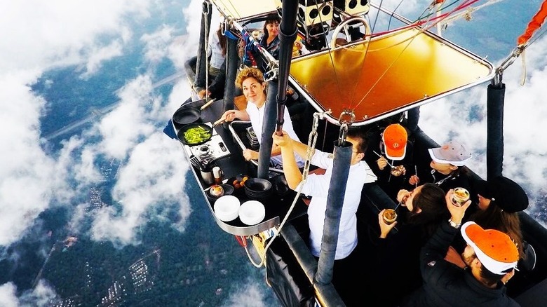 Chef cooking in hot air balloon