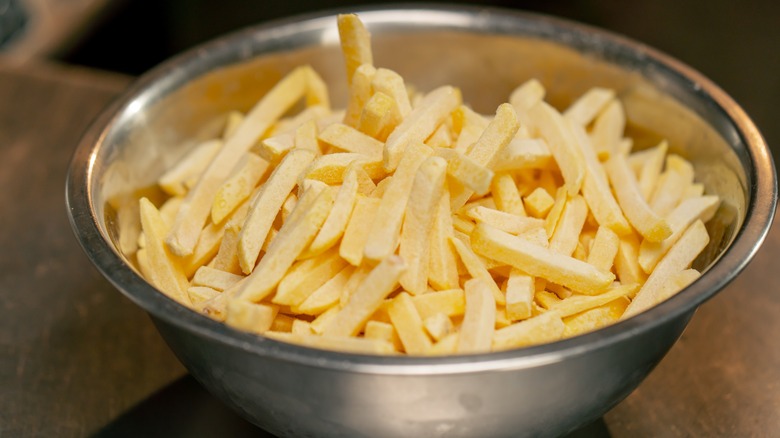 metal bowl of French fries