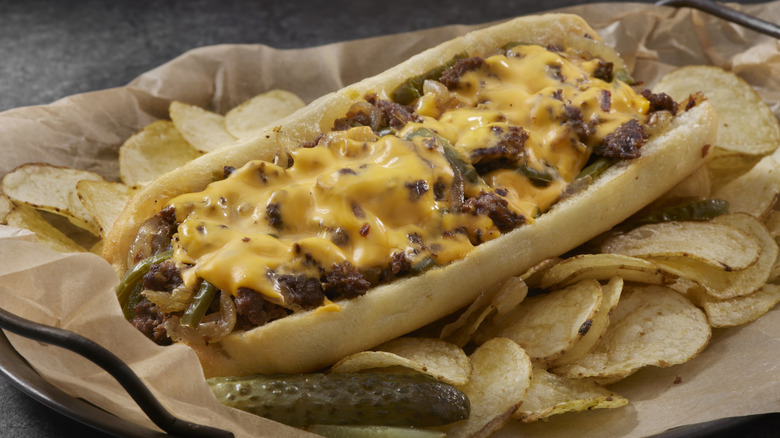 cheesesteak sandwich with chips