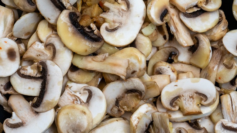 Mushrooms overlapping one another in a pan
