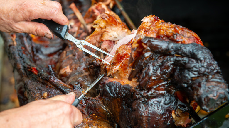 Roast pig being carved