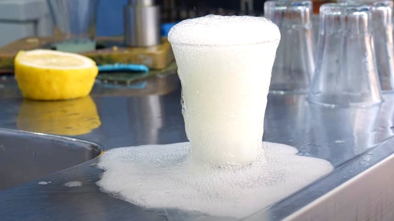 Woman drinking fizzy lemonade