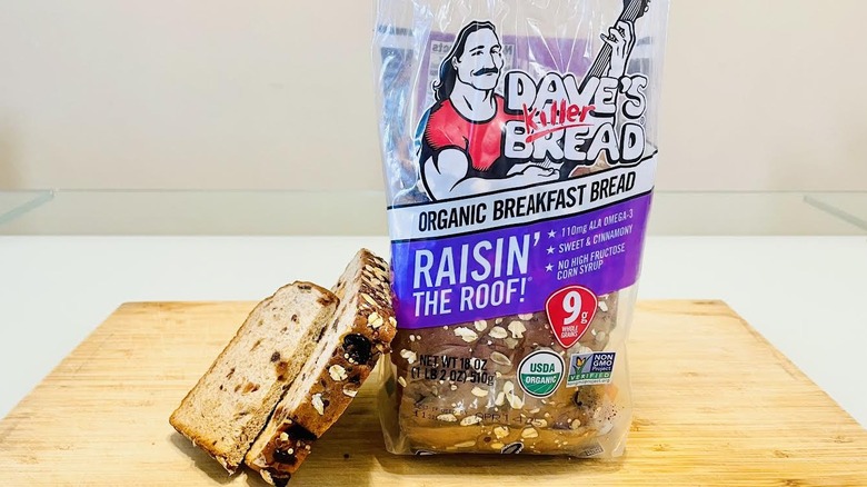 Loaf of Dave's Killer Cinnamon Raisin' The Roof Bread with slices on side