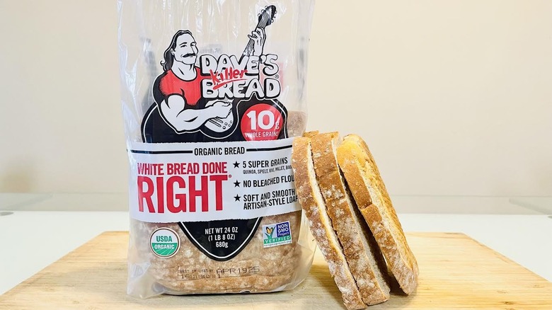 Loaf of Dave's Killer Organic White Bread Done Right with slices on side