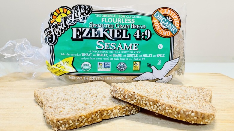 Loaf of Ezekiel Sesame Bread with slices in front