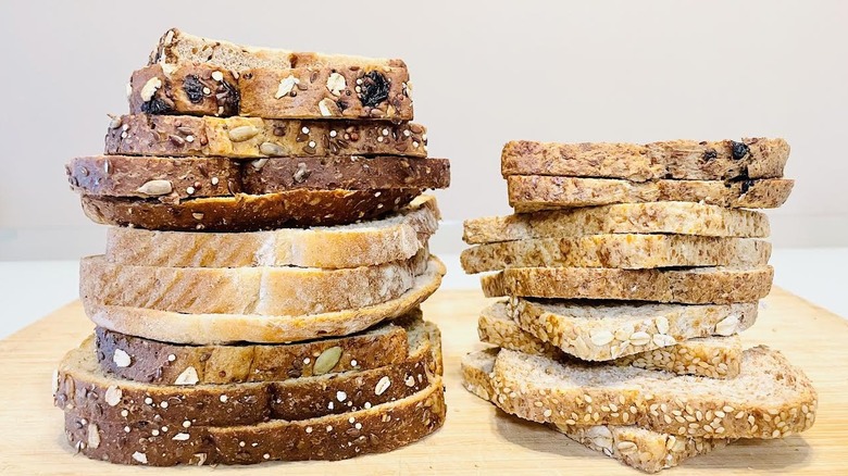 Stacks of Dave's Killer and Ezekiel bread in various flavors