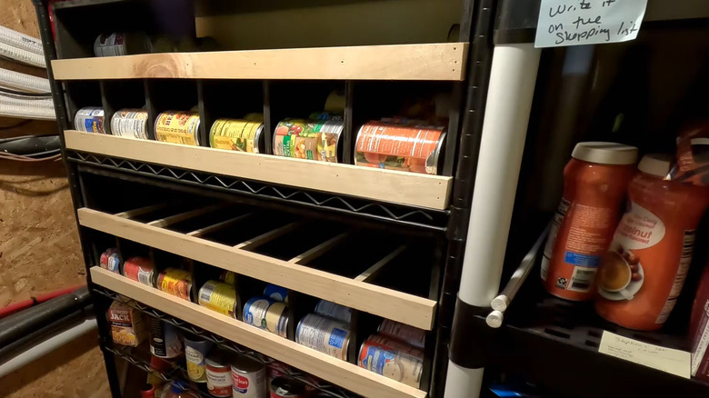 The assembled can organizer, stocked with canned foods.
