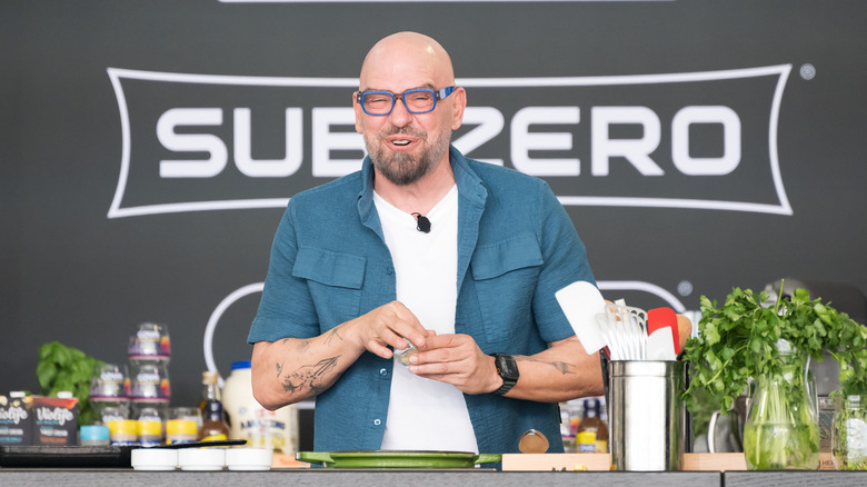 Michael Symon giving a live cooking demonstration