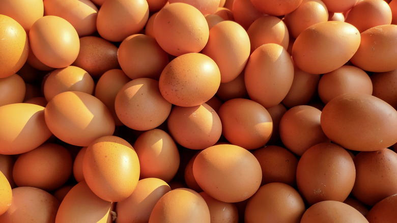 A pile of beautiful organic brown eggs