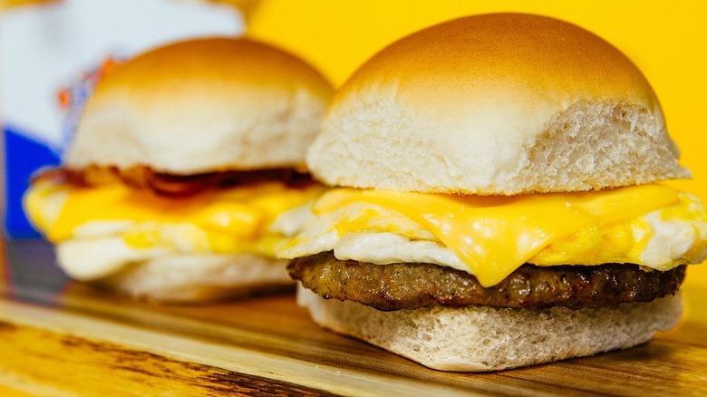 Close-up of square White Castle breakfast slider with egg, cheese, and sausage