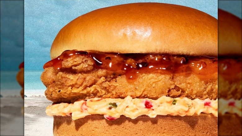 A Hot Honey Crisp Whatachick'n sandwich in an outdoor setting.