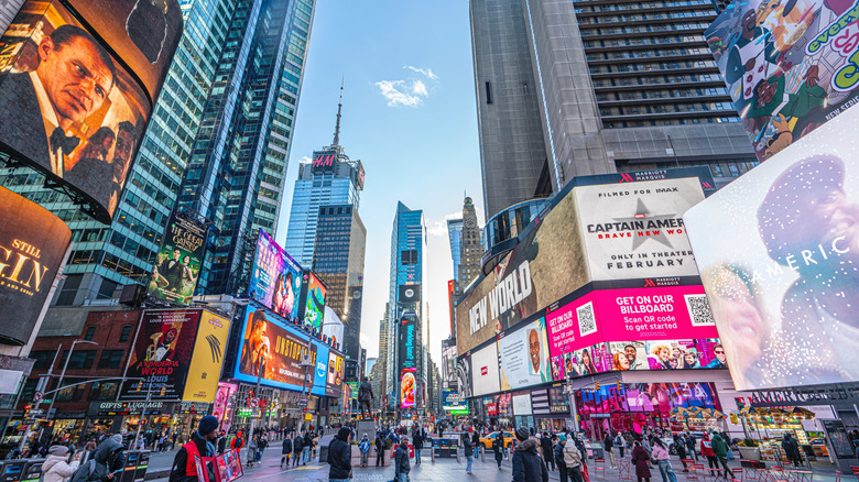 Times Square, Manhattan, New York, U.S.-January 08, 2025: tourists are visiting the Times Square with colorful lights in Manhattan. US