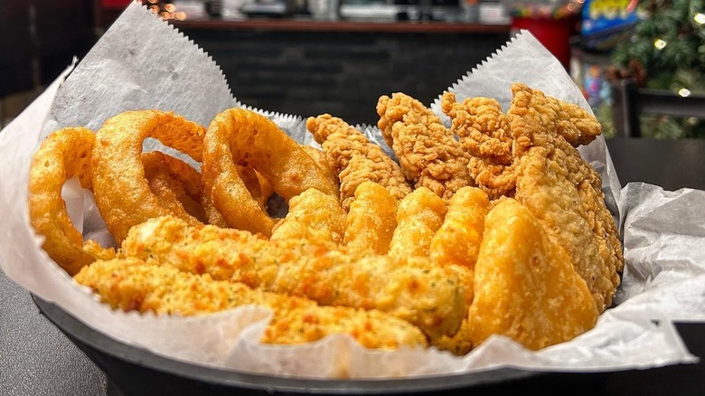A basket of various fried Fat Shack foods